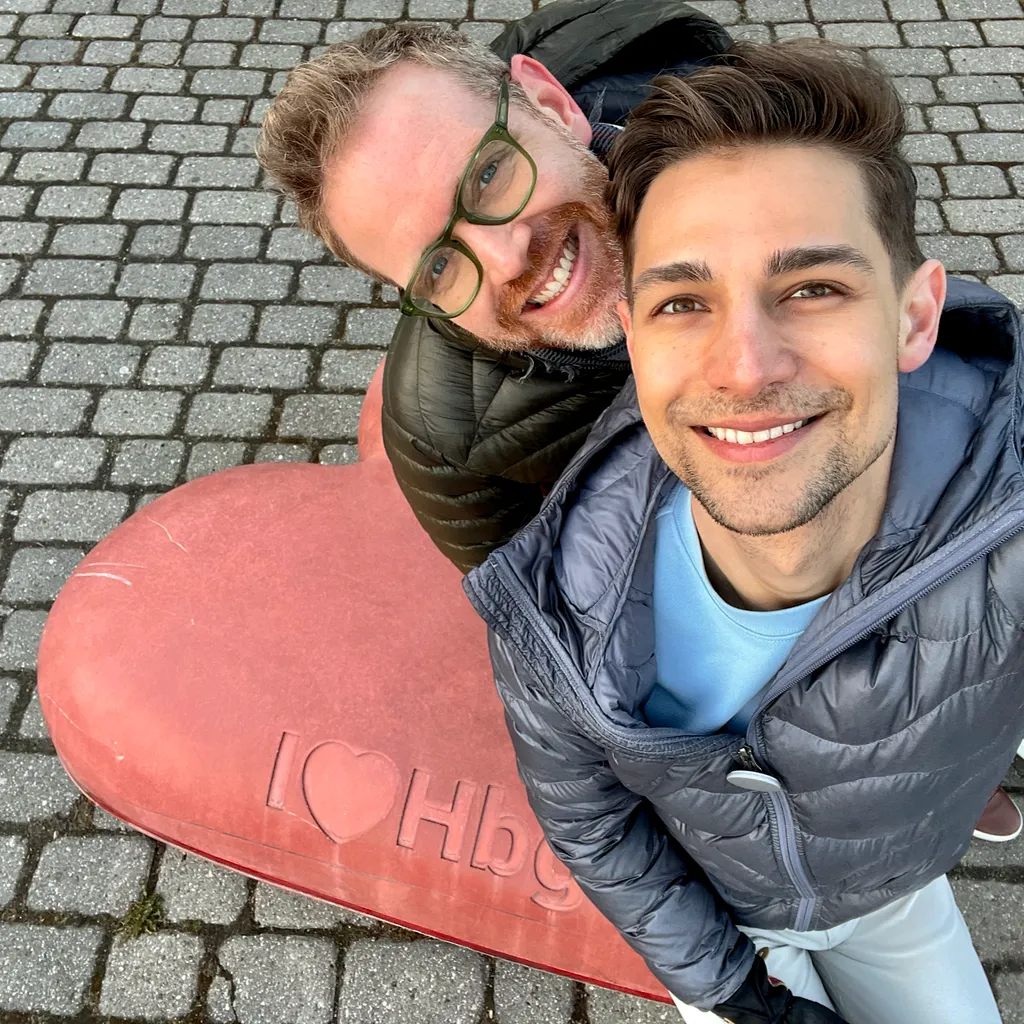 Jeremiah and Arthur sitting on a heart shaped rock