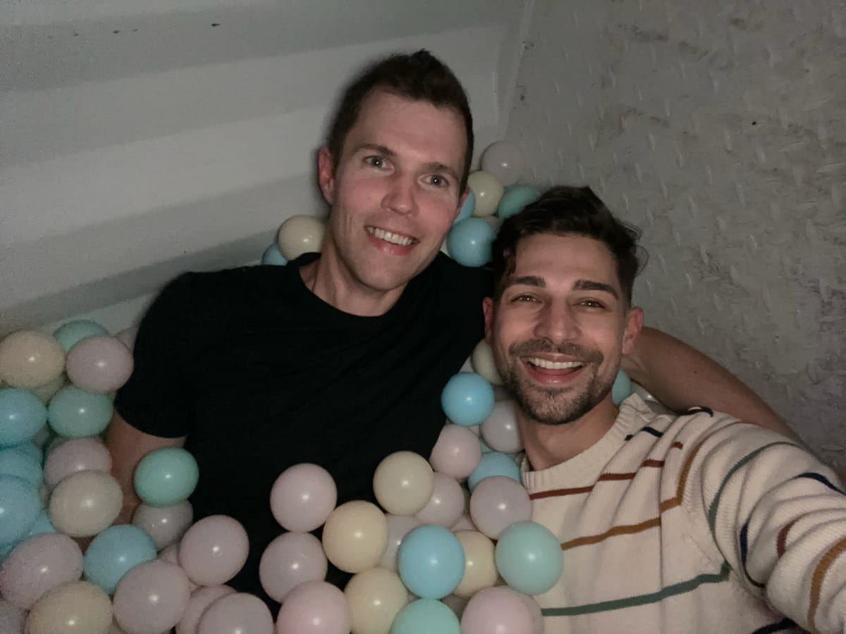 Eric and Jeremiah sitting in ball pit at Nordic.js