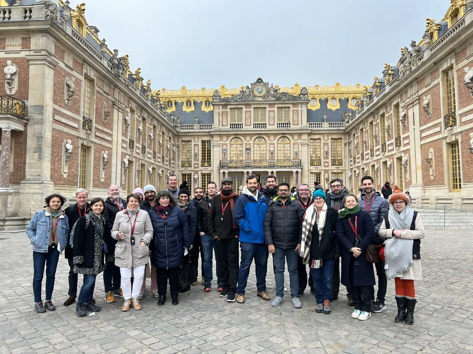 Group of API nerds standing in front of Palace of Versailles