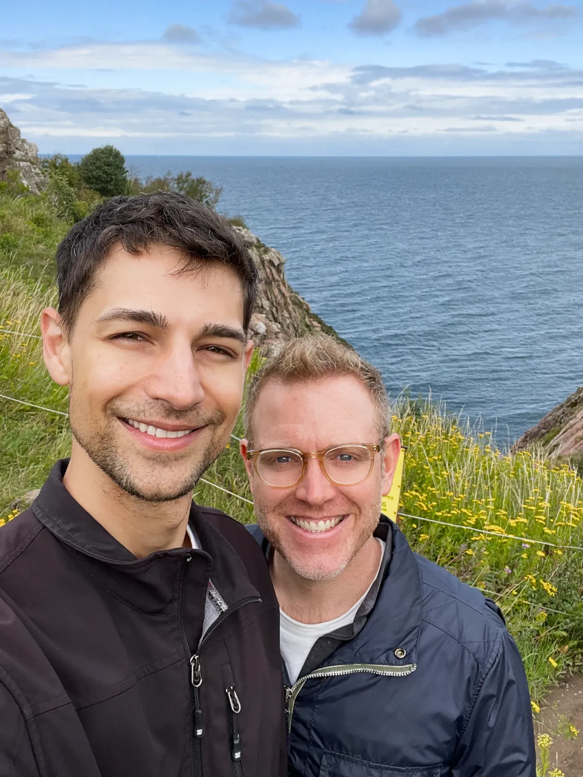 Jeremiah and Arthur standing on craggy coastline at Kullaberg