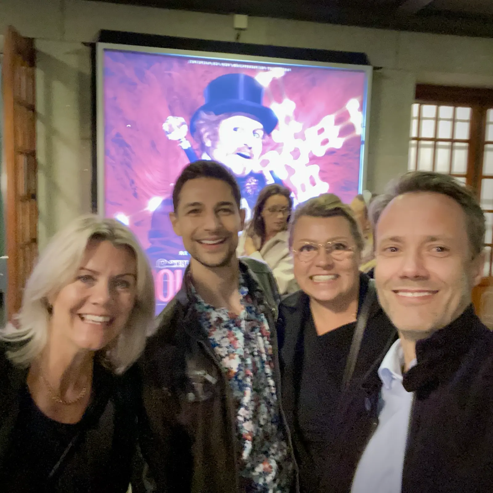 Ulrika, Jeremiah, Ulrika, Johan in front of Moulin Rouge sign outside theater