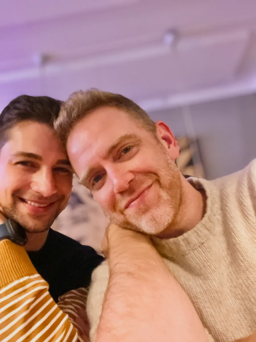 Jeremiah and Arthur smiling at dinner