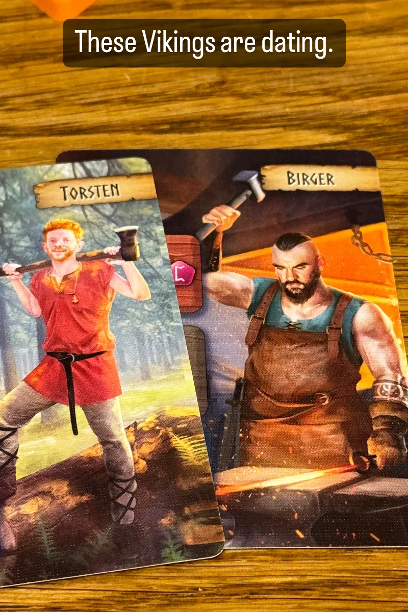 These Vikings are dating. Left card is Torsten, a slender but muscular ginger lumberjack with facial scruff. Right card is Birgir, a very muscular blacksmit with mohawk and short beard